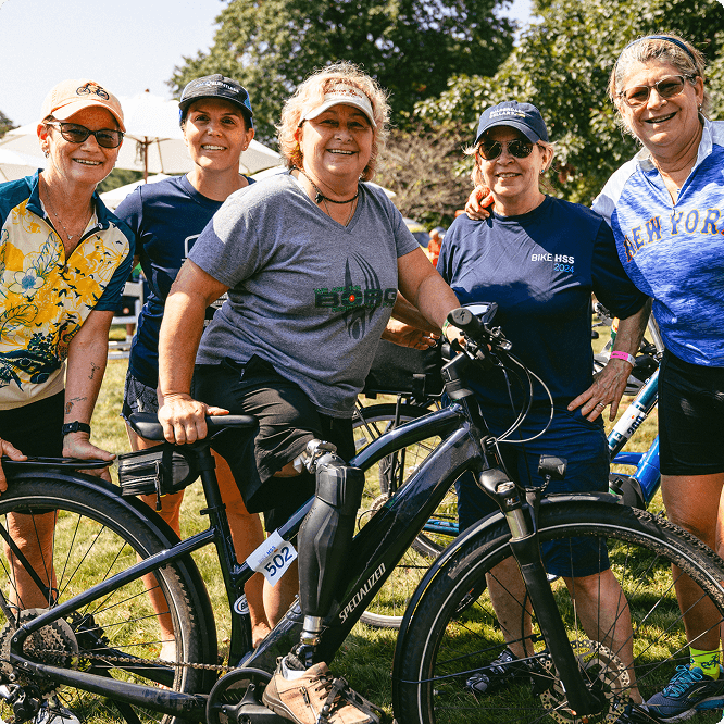 Group of bike riders smiling at the camera