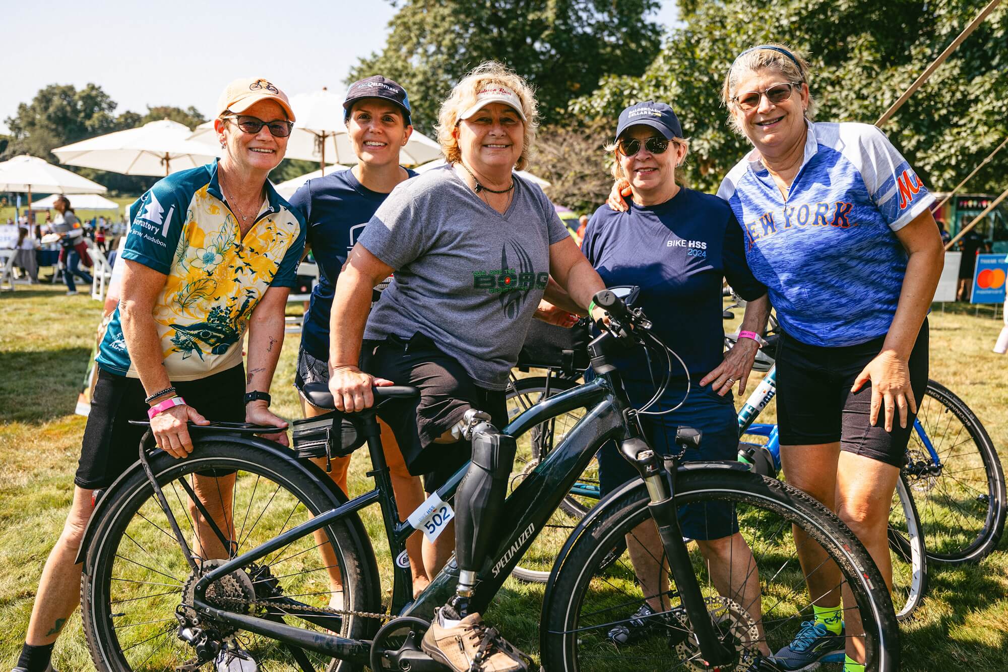 Group of bike riders smiling at the camera