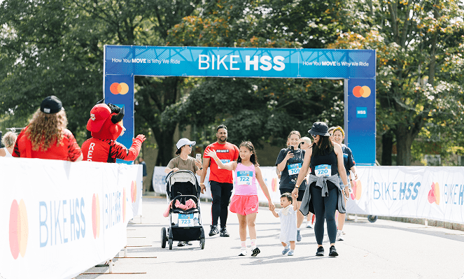 Family crossing last year's finish line together