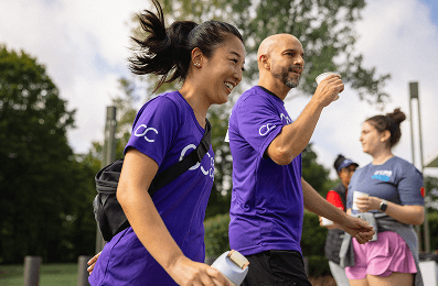 People running next to a person running behind a kids stroller