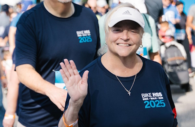People running next to a person running behind a kids stroller